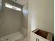 Bathroom with walk-in shower and built-in seat at 1505 Maelyn Way, Fuquay Varina, NC 27526