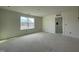 Spacious bedroom with a window and new flooring at 1505 Maelyn Way, Fuquay Varina, NC 27526