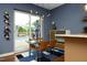 Small dining area with glass table and chairs, near the kitchen and pool at 4416 Environ Way, Chapel Hill, NC 27517