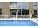 Inviting pool with patio furniture and building access at 4416 Environ Way, Chapel Hill, NC 27517