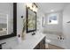 Modern bathroom with double vanity, soaking tub, and separate shower at 901 Myers Point Dr # 17, Morrisville, NC 27560