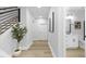 Clean hallway with white bathroom vanity and toilet at 901 Myers Point Dr # 17, Morrisville, NC 27560