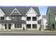 Two-story townhome with modern farmhouse style, gray and white exterior at 901 Myers Point Dr # 17, Morrisville, NC 27560