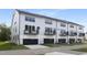Rear view of townhomes with garages at 901 Myers Point Dr # 17, Morrisville, NC 27560