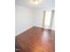 Well-lit bedroom with hardwood floors and neutral decor at 6220 Sweden Dr, Raleigh, NC 27612