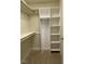 Well-organized closet with shelves and hanging space at 3318 Denada Path, Durham, NC 27707