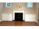 Gas fireplace with white mantel and built-in shelving at 3318 Denada Path, Durham, NC 27707