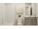 Clean bathroom with a single vanity, shower/tub combo, and neutral decor at 512 Hester Rd, Durham, NC 27703