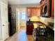 Modern kitchen with stainless steel appliances and granite countertops at 202 Delacroix St, Oxford, NC 27565