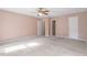 Spacious bedroom with neutral walls, ceiling fan, and ensuite bathroom access at 14 Stone Village Ct, Durham, NC 27704