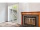 Living area with sliding glass door to patio and a wood-burning fireplace at 14 Stone Village Ct, Durham, NC 27704