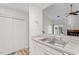 White kitchen with granite countertops and modern appliances at 14 Stone Village Ct, Durham, NC 27704