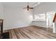 Bright living room features hardwood floors and a kitchen with breakfast bar at 14 Stone Village Ct, Durham, NC 27704