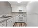 White kitchen with granite countertops and modern appliances at 14 Stone Village Ct, Durham, NC 27704
