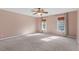 Large bedroom with neutral walls and ceiling fan at 14 Stone Village Ct, Durham, NC 27704