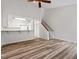 Spacious living room with hardwood floors, fireplace, and kitchen views at 14 Stone Village Ct, Durham, NC 27704