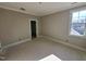 Neutral-toned bedroom with a window and closet at 20 Water Willow Ln, Zebulon, NC 27597