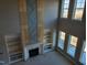 Modern fireplace with built-in shelving and wood accents at 20 Water Willow Ln, Zebulon, NC 27597