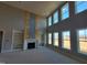 Spacious living room featuring a floor to ceiling fireplace and large windows at 20 Water Willow Ln, Zebulon, NC 27597