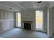 Spacious Gathering room with fireplace and large windows offering natural light at 2401 Terri Creek N Dr # 08, Fuquay Varina, NC 27526