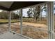 Screened porch with view of large backyard and surrounding landscape at 2401 Terri Creek N Dr # 08, Fuquay Varina, NC 27526