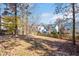 Landscaped side yard with wooden fence and trees at 2618 Needle Pine Dr, Apex, NC 27539