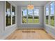 Breakfast nook with hardwood floors and large windows offering natural light at 5100 Grist Stone Way, Youngsville, NC 27596