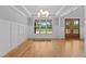 Bright dining room with hardwood floors, large windows, and coffered ceiling at 5100 Grist Stone Way, Youngsville, NC 27596