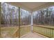 Wooden back porch overlooking a wooded backyard at 67 Earl Ct, Smithfield, NC 27577