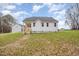 Exterior view of a single-story house with a backyard at 67 Earl Ct, Smithfield, NC 27577