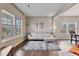 Living room with light gray sectional sofa and rug at 1221 Chimney Ridge Dr, Fuquay Varina, NC 27526