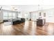 Spacious living room with hardwood floors and sliding glass doors at 181 Glenwood Pl, Kenly, NC 27542