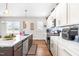 Modern kitchen with island, stainless steel appliances, and hardwood floors at 181 Glenwood Pl, Kenly, NC 27542