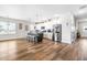 Modern kitchen with island, stainless steel appliances, and hardwood floors at 181 Glenwood Pl, Kenly, NC 27542