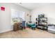 Bright home office features built-in shelving and a comfortable seating area at 181 Glenwood Pl, Kenly, NC 27542