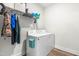 Laundry room with washer, dryer, and ample storage shelving at 181 Glenwood Pl, Kenly, NC 27542