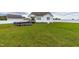 Large backyard with a covered patio and above ground pool at 181 Glenwood Pl, Kenly, NC 27542