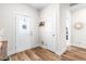 Bright entryway with hardwood floors and coat closet at 181 Glenwood Pl, Kenly, NC 27542