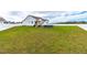 Spacious backyard with a large grassy area and privacy fence at 181 Glenwood Pl, Kenly, NC 27542