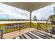 Relaxing back deck overlooks a spacious yard with a hot tub at 181 Glenwood Pl, Kenly, NC 27542