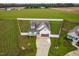 Aerial view shows a charming house with a large backyard at 181 Glenwood Pl, Kenly, NC 27542