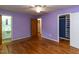 Bedroom with hardwood floors, a walk-in closet, and access to a bathroom at 511 Strother Road Rd, Raleigh, NC 27606