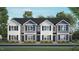 Three story townhome exterior with gray siding and navy trim at 125 Holmes Corner Dr, Smithfield, NC 27577