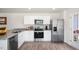 Modern kitchen featuring stainless steel appliances and granite countertops at 125 Holmes Corner Dr, Smithfield, NC 27577