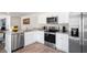 Modern kitchen with stainless steel appliances and granite countertops at 125 Holmes Corner Dr, Smithfield, NC 27577
