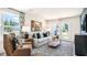 Living room with comfy seating, large windows and a fireplace at 125 Holmes Corner Dr, Smithfield, NC 27577
