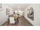 Bright dining room with hardwood floors and kitchen views at 131 Holmes Corner Dr, Smithfield, NC 27577
