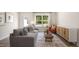 Relaxing living room with a sofa, armchair, and a large window at 131 Holmes Corner Dr, Smithfield, NC 27577