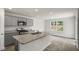 Modern kitchen with gray cabinets, granite countertops, and stainless steel appliances at 236 Holton St, Smithfield, NC 27577