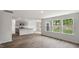 Open kitchen features island and modern appliances, overlooking the spacious living area at 236 Holton St, Smithfield, NC 27577